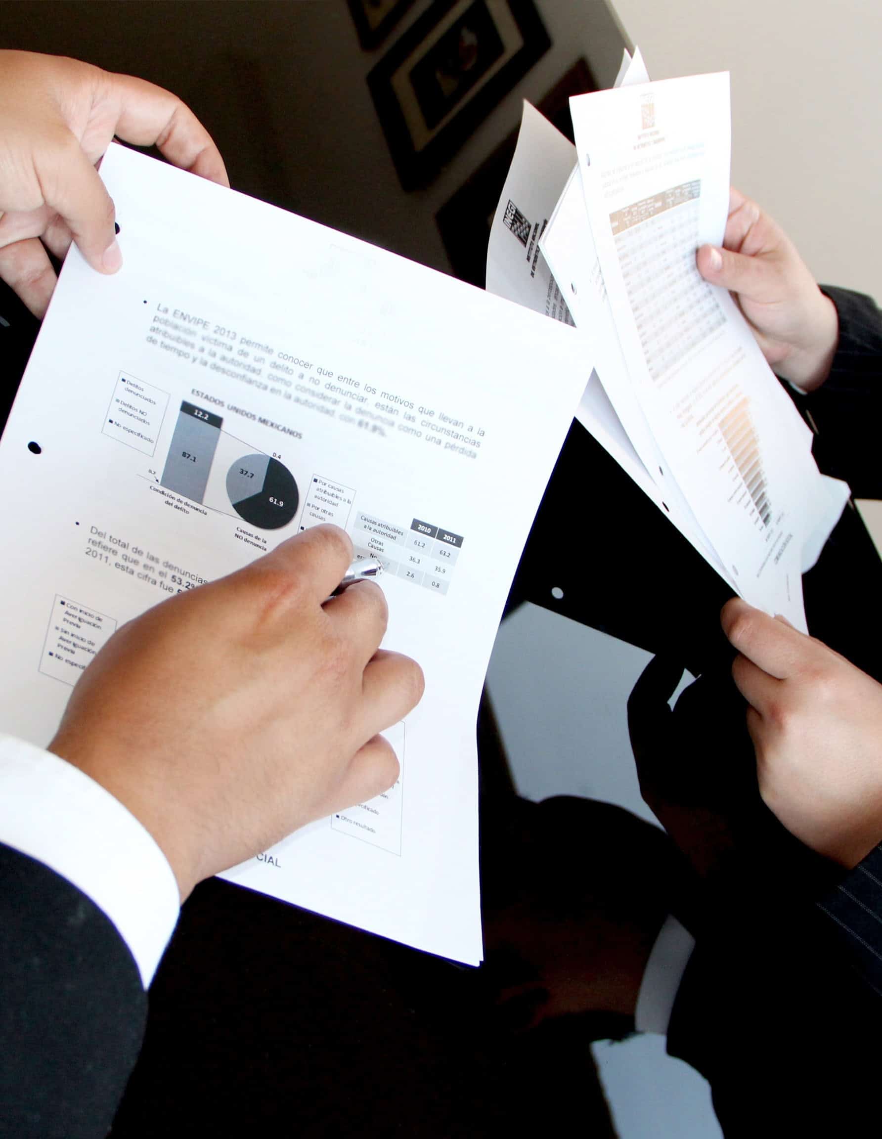 Reviewing financial statements and charts for a business valuation